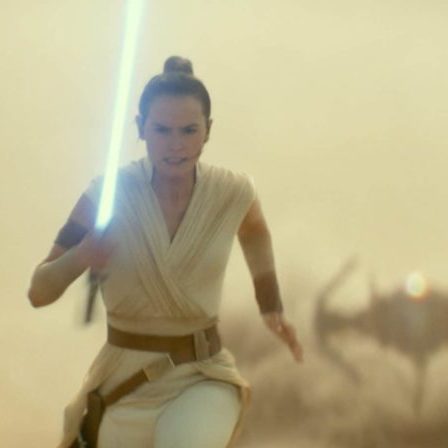 Rey running with lightsaber away from tie fighter in the desert Rise of Skywalker Parent movie review