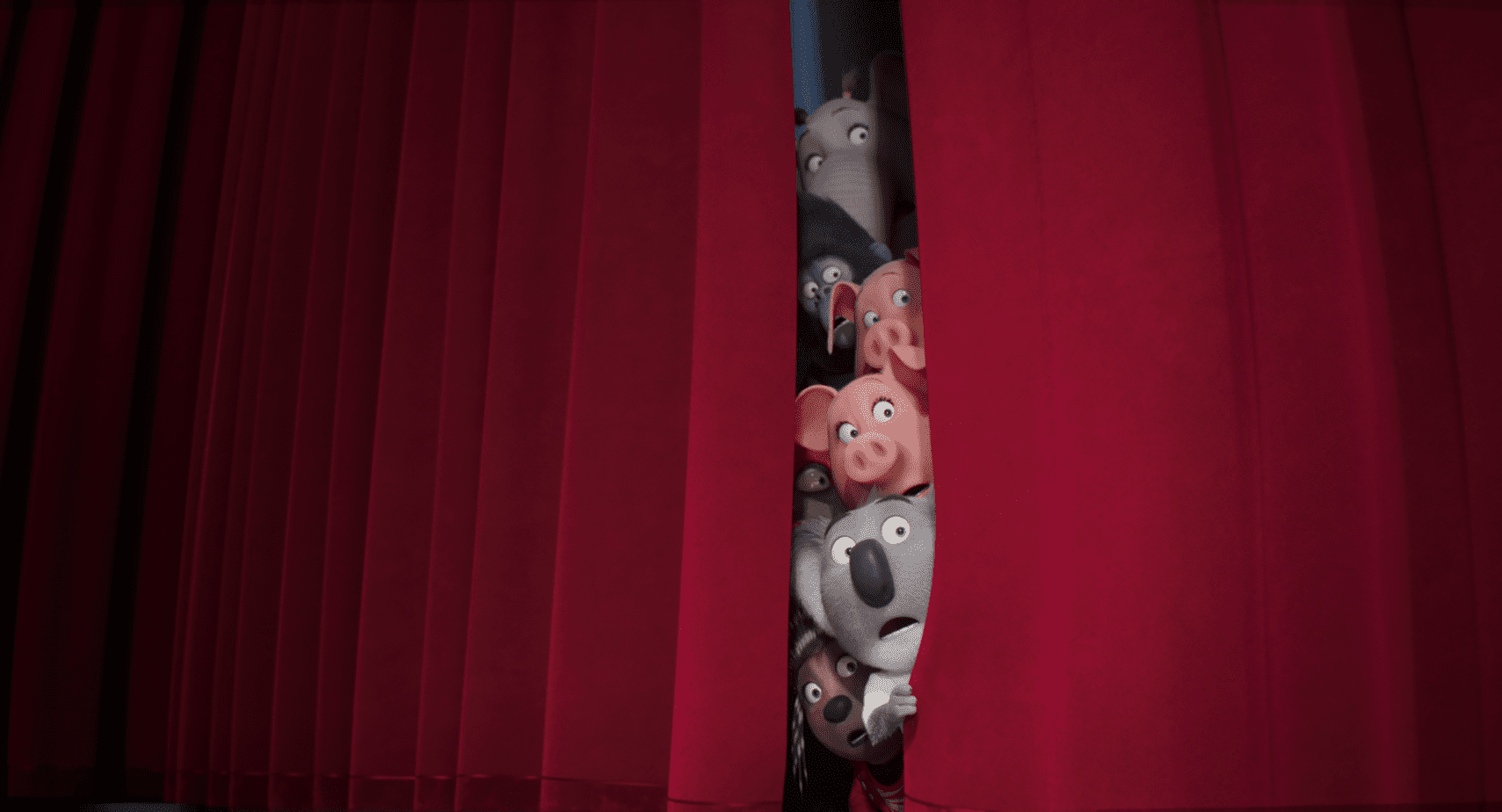 is sing 2 ok for kids parent movie review. sing 2 cast peeking out from red stage curtains