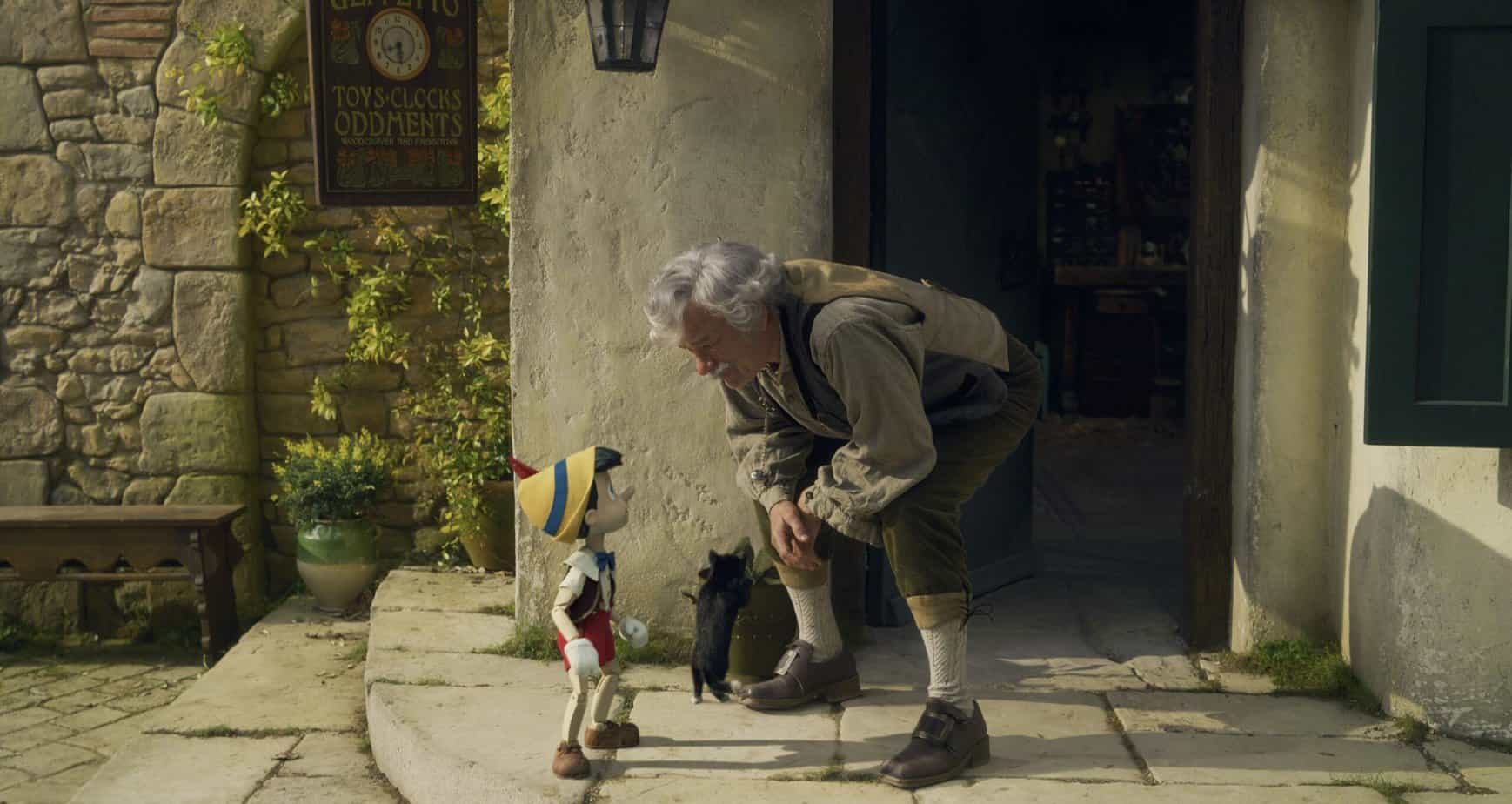 age rating for  Pinocchio 2022 on disney plus. Is it ok for kids? parents guide. wooden boy and old man bent over talking.