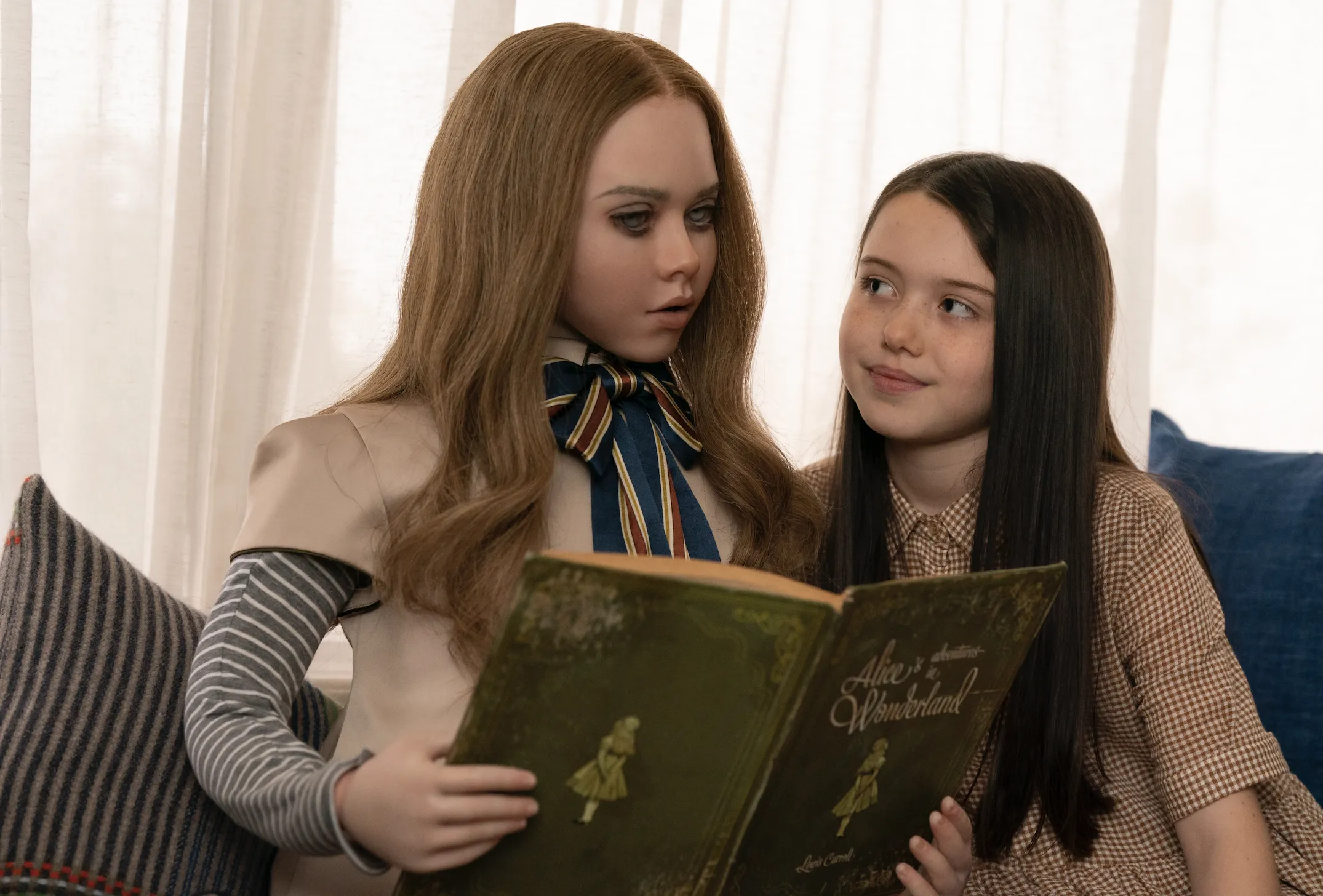 age rating of M3GAN parents guide. Megan movie 2023. One girl and one doll reading a book.