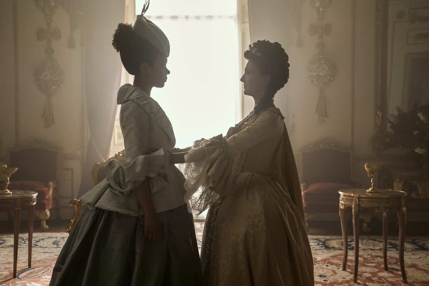 India Amarteifio as Young Queen Charlotte, Michelle Fairley as Princess Augusta in episode 101 of Queen Charlotte: A Bridgerton Story. parents guide.