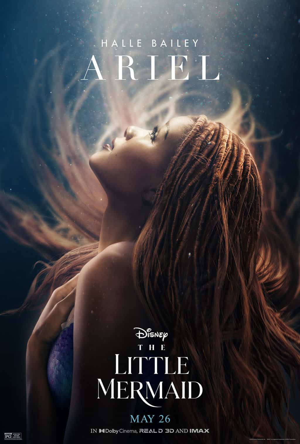 age rating of THE LITTLE MERMAID (2023) parents guide. Ariel flipping her hair back underwater. 