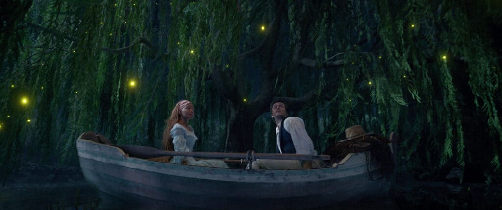 parents guide to The Little Mermaid 2023. Age rating. Halle Bailey as Ariel and Jonah Hauer-King as Prince Eric sit in a boat across from each other. 